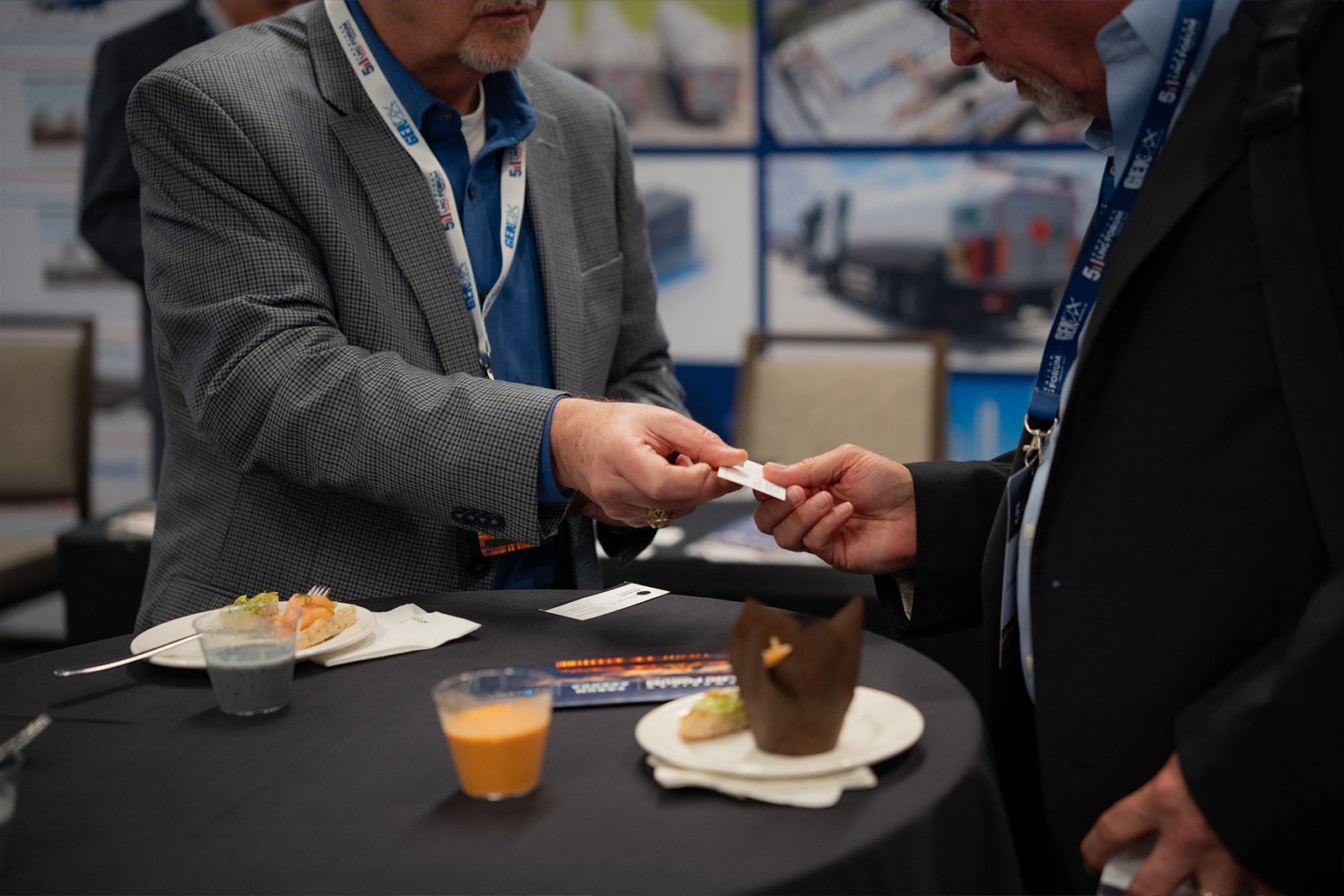 American LNG forum attendees exchanges business cards during networking session