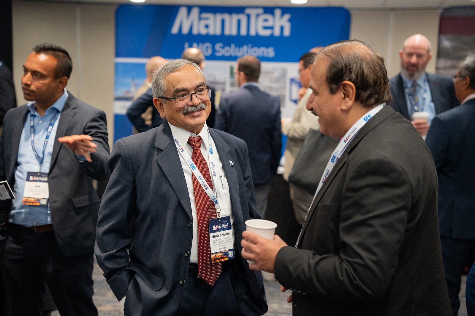 American LNG Forum attendee from Black & Veatch networking in front of MannTek LNG solutions stand